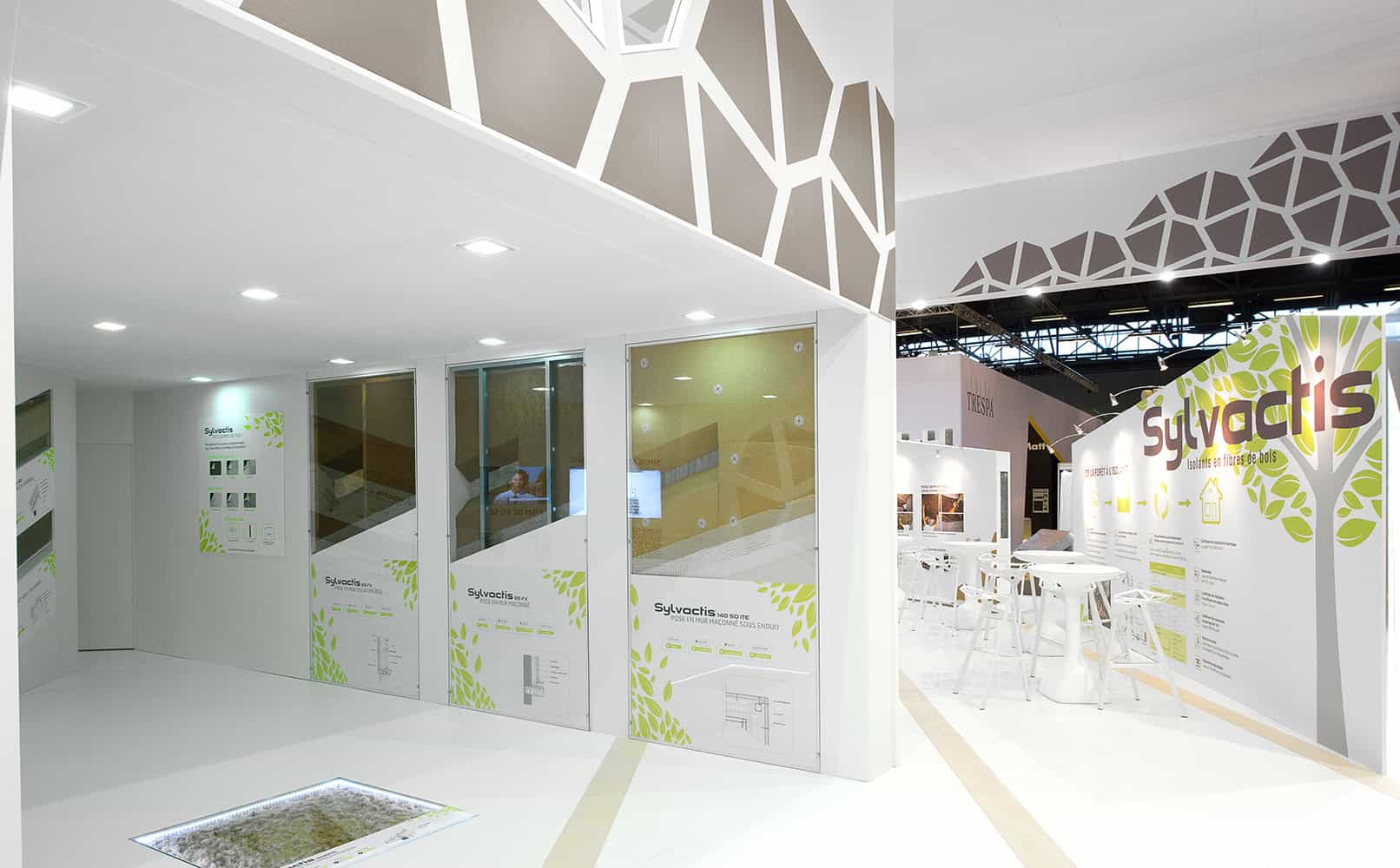 Modern Co-Nect booth at Actis with informational displays and seating area.