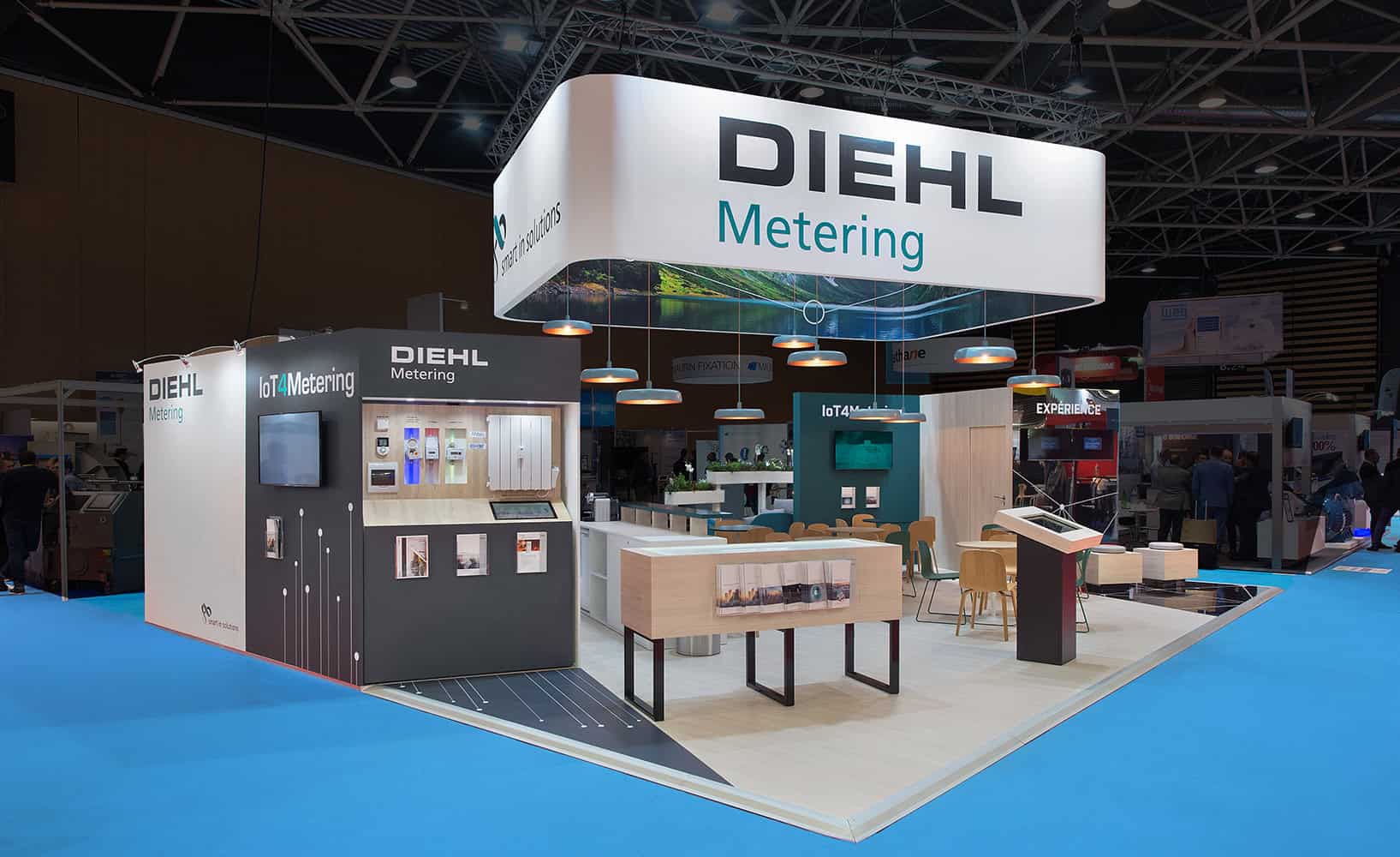 Diehl's booth at a trade show, featuring modern interior design and furniture.