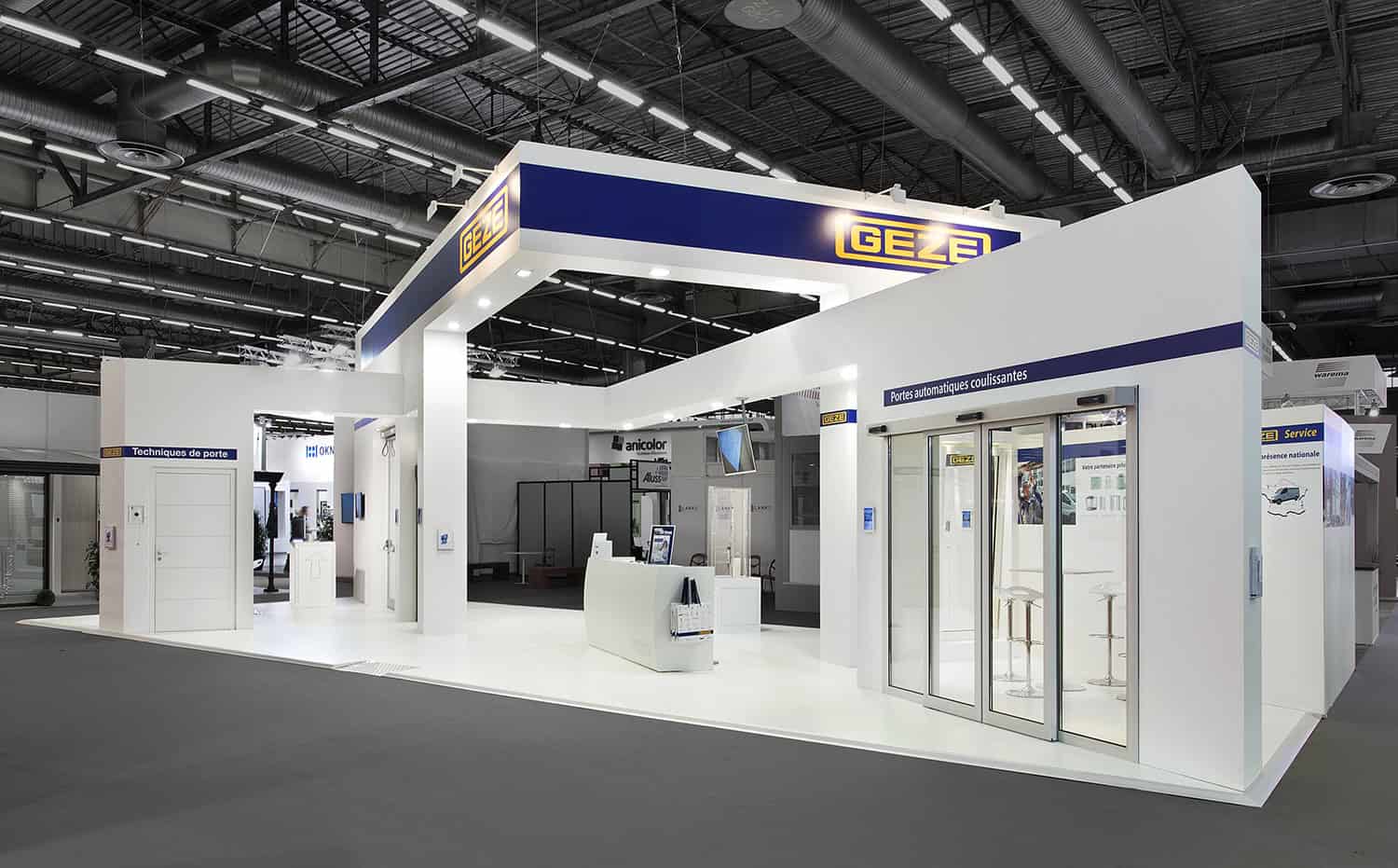 Modern Geze booth showcasing innovative door and window solutions at trade show.