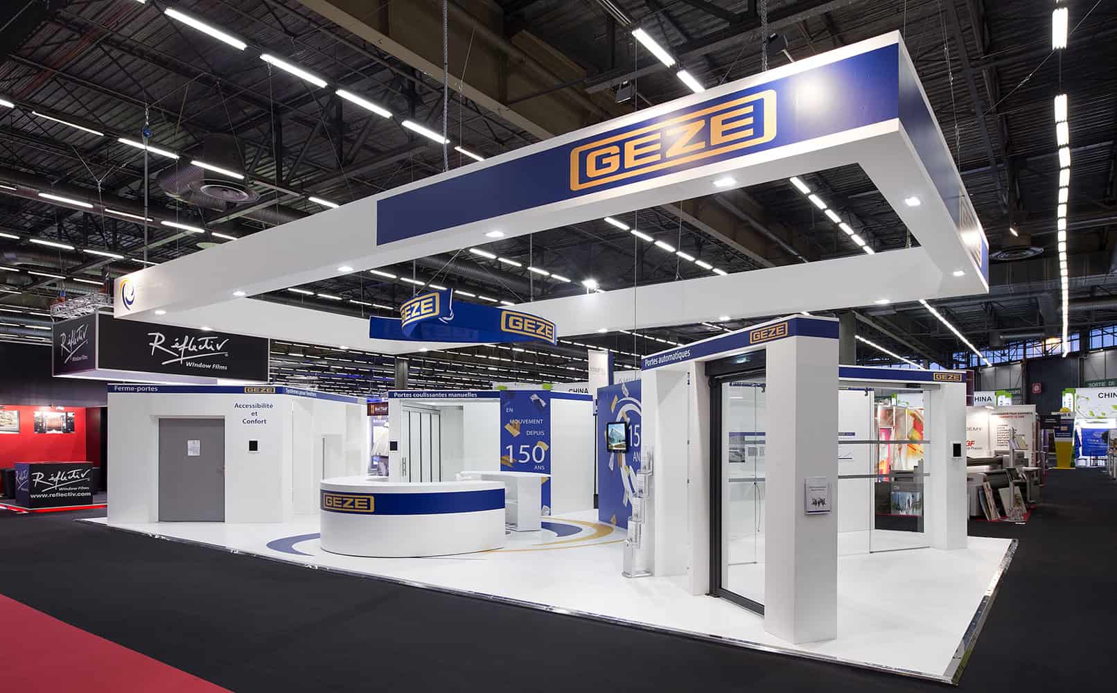 Geze booth at trade show showcasing innovative door and window solutions.