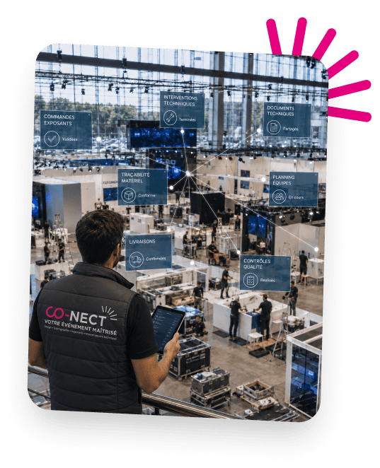 Event coordinator managing logistics at Co-Nect trade show in a large exhibition hall.