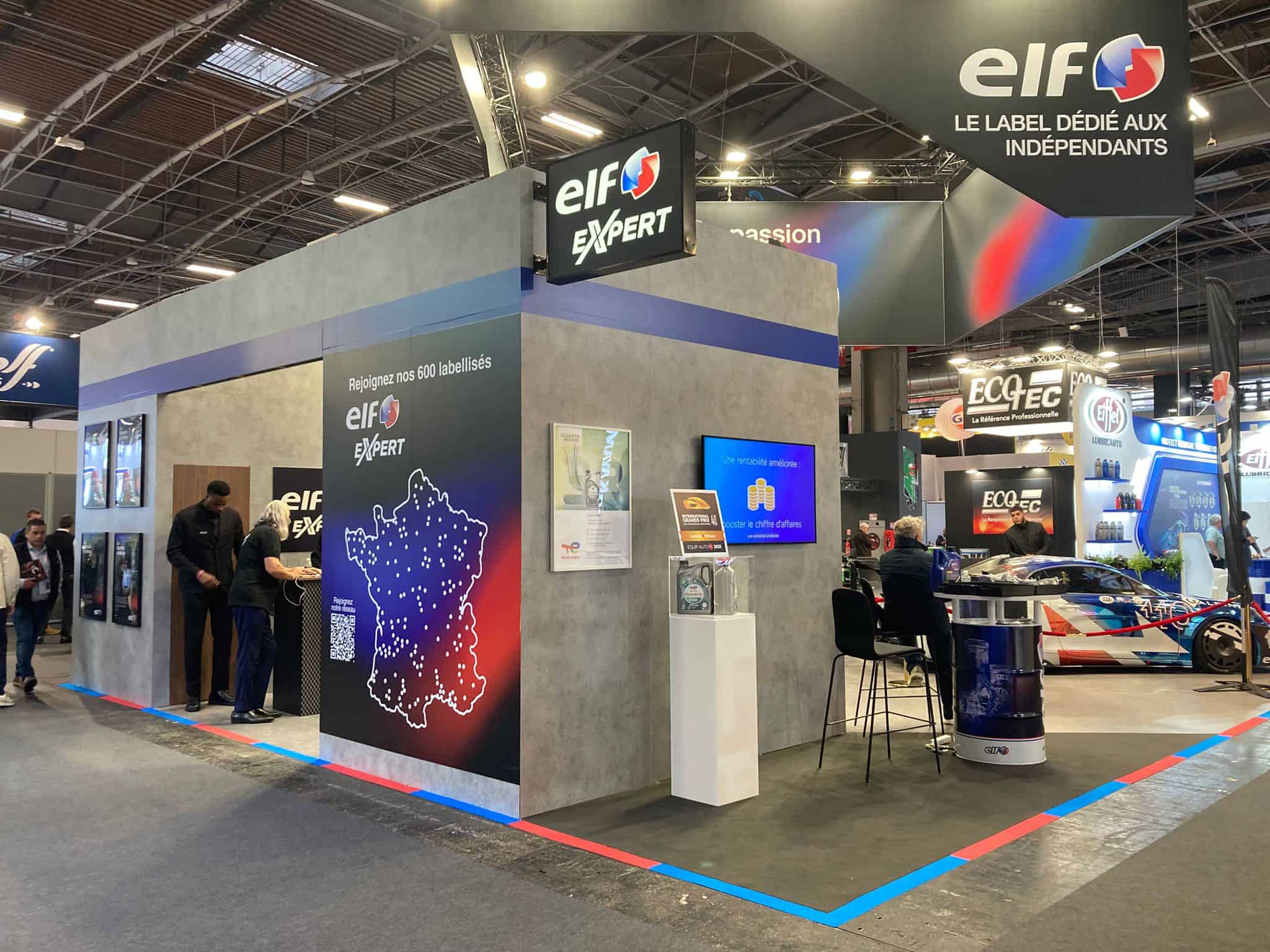 Elf Expert booth showcasing automotive products at trade show.