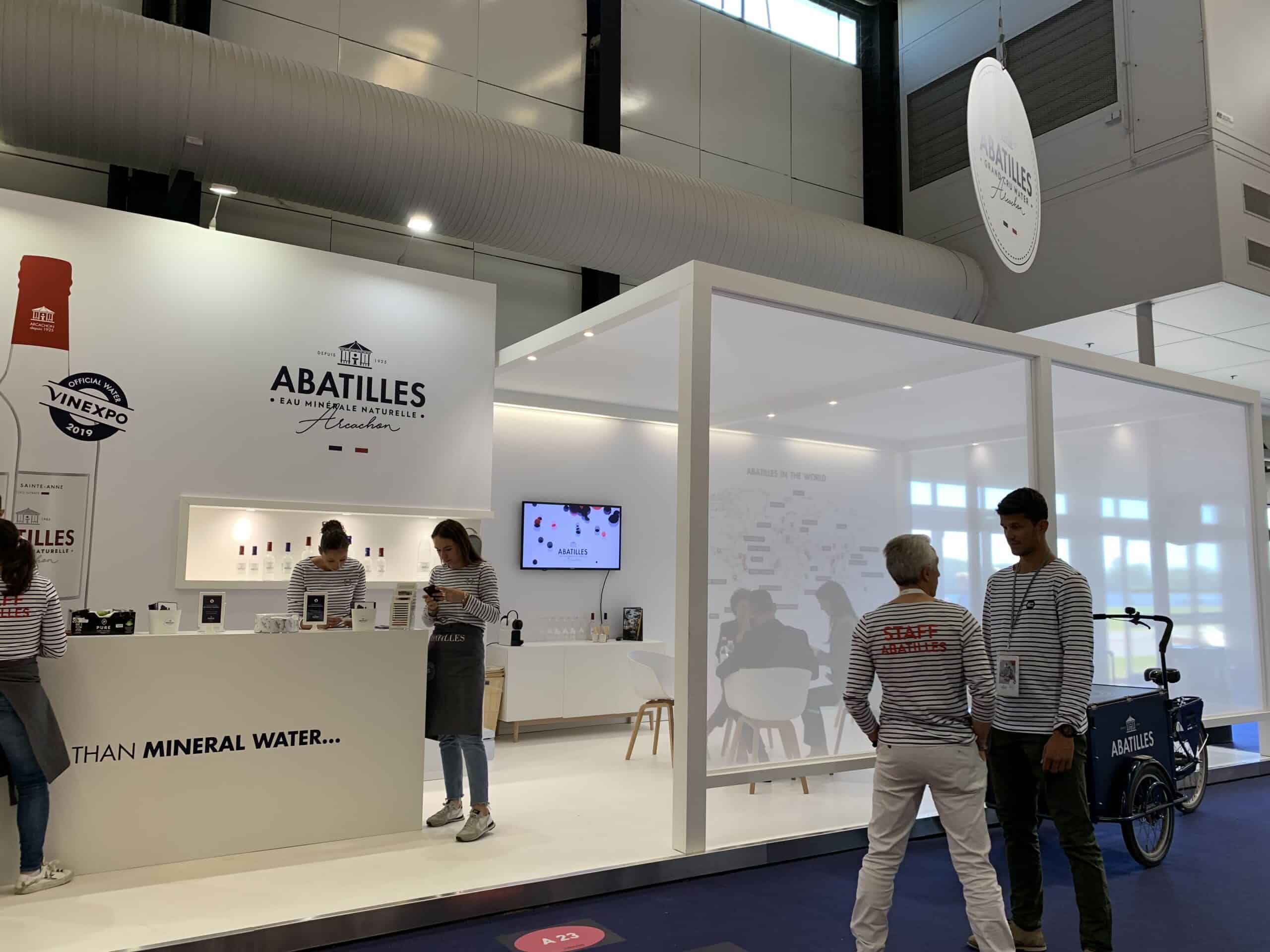 Abatilles booth at trade show showcasing mineral water products and services.
