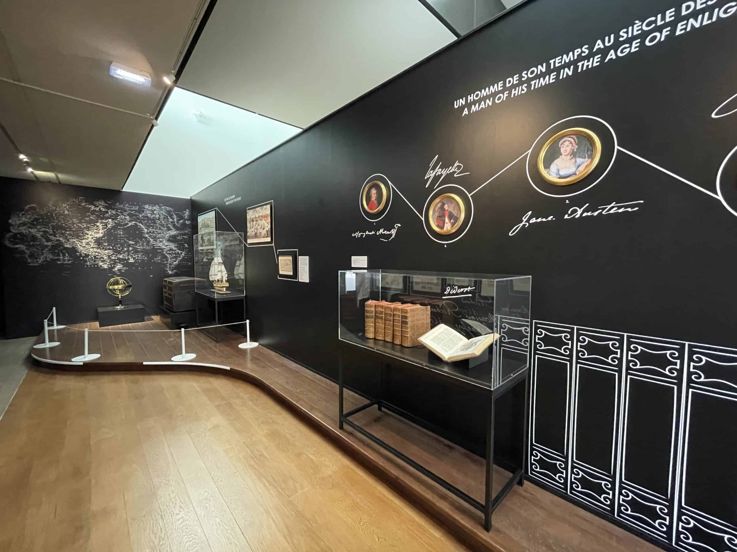 Exhibit showcasing historical figures and artifacts in a museum setting.