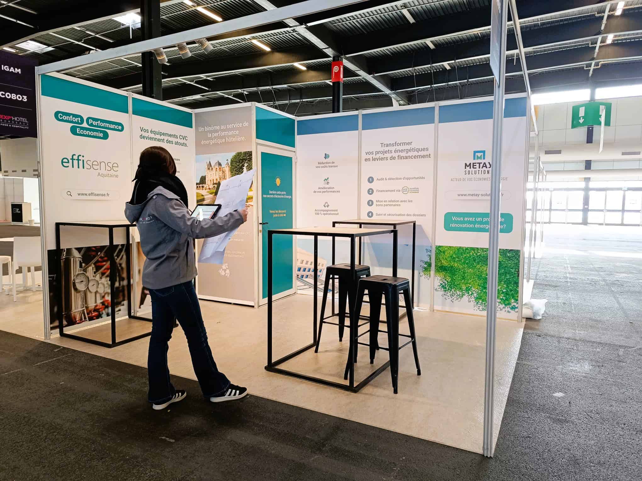 Exhibition booth at Co-Nect event showcasing digital transformation solutions.