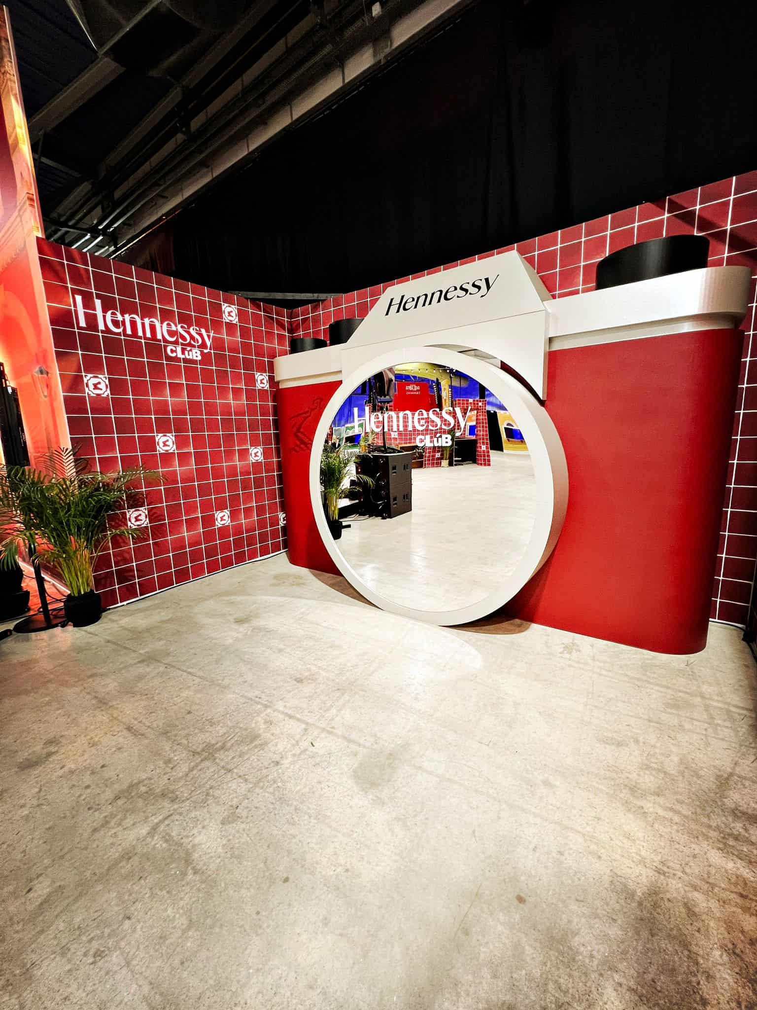 Hennessy booth at the Hennessy Convention with red and white branding.