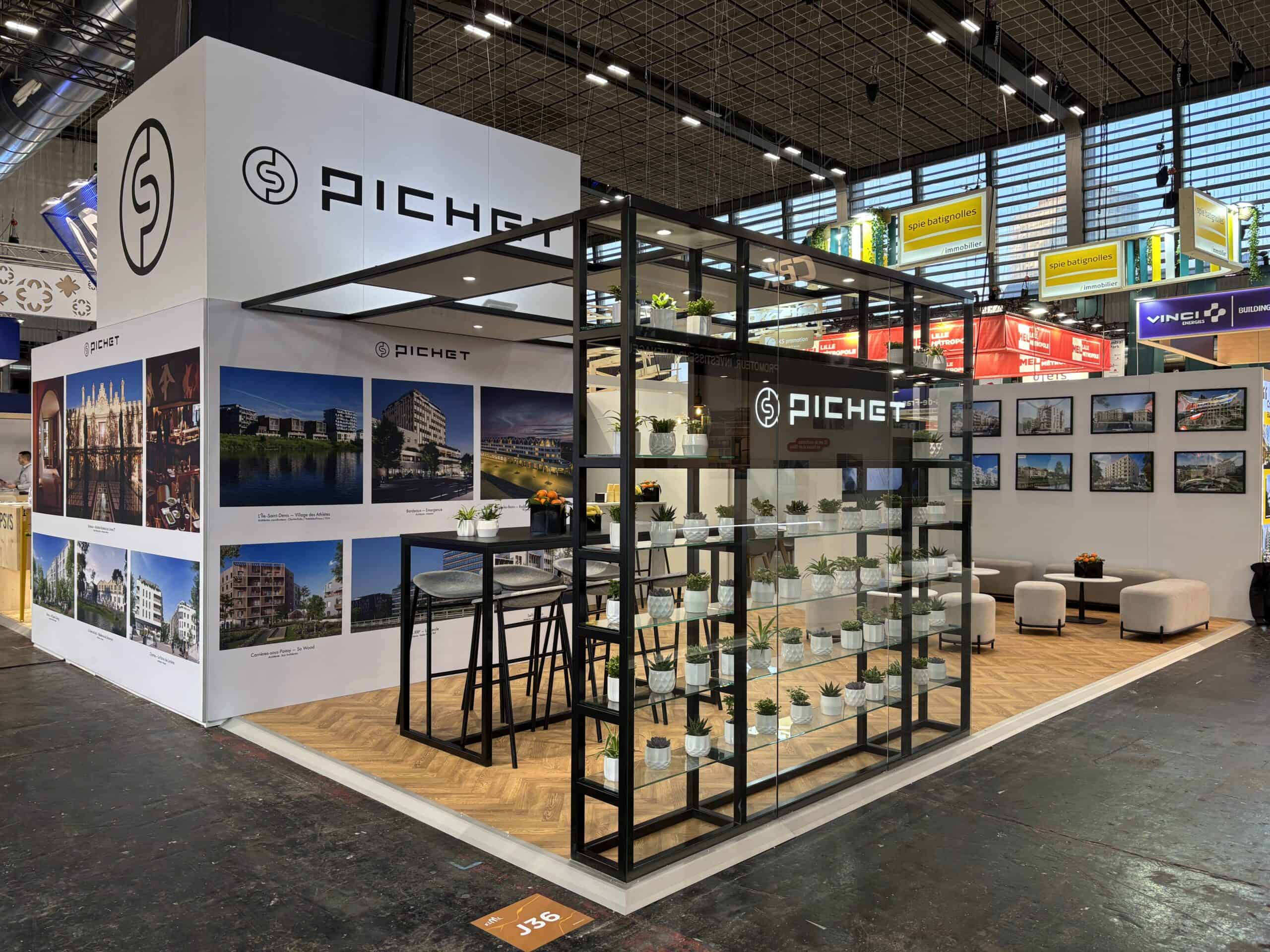 Co-Nect exhibition booth showcasing architectural projects and displays.