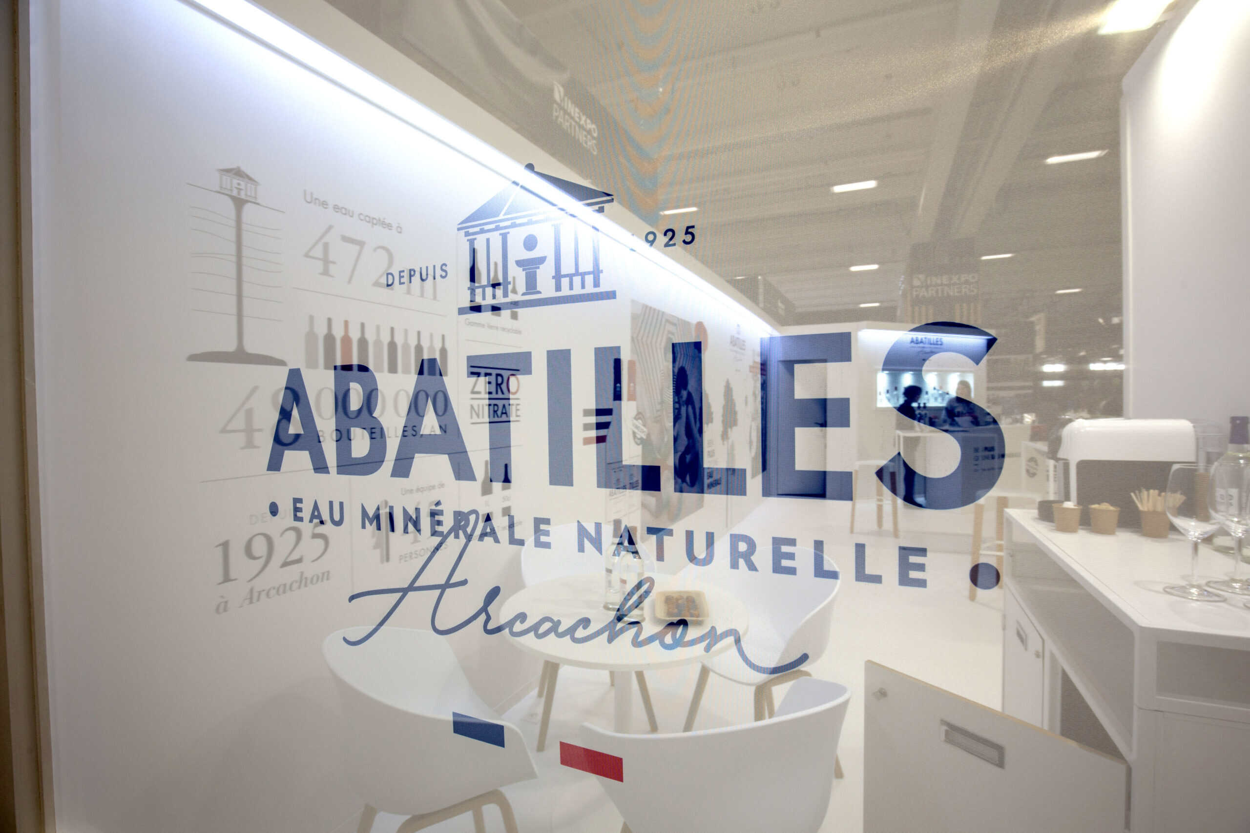 Abatilles logo on a glass wall at the Abatilles facility.