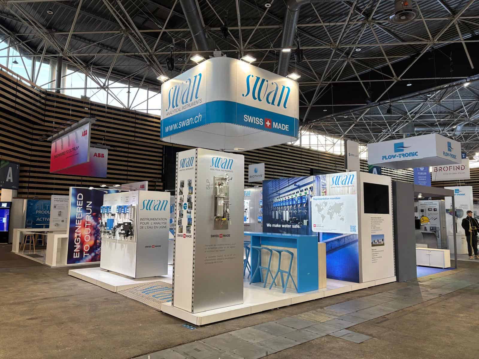 Swan booth at a trade show showcasing water treatment solutions.