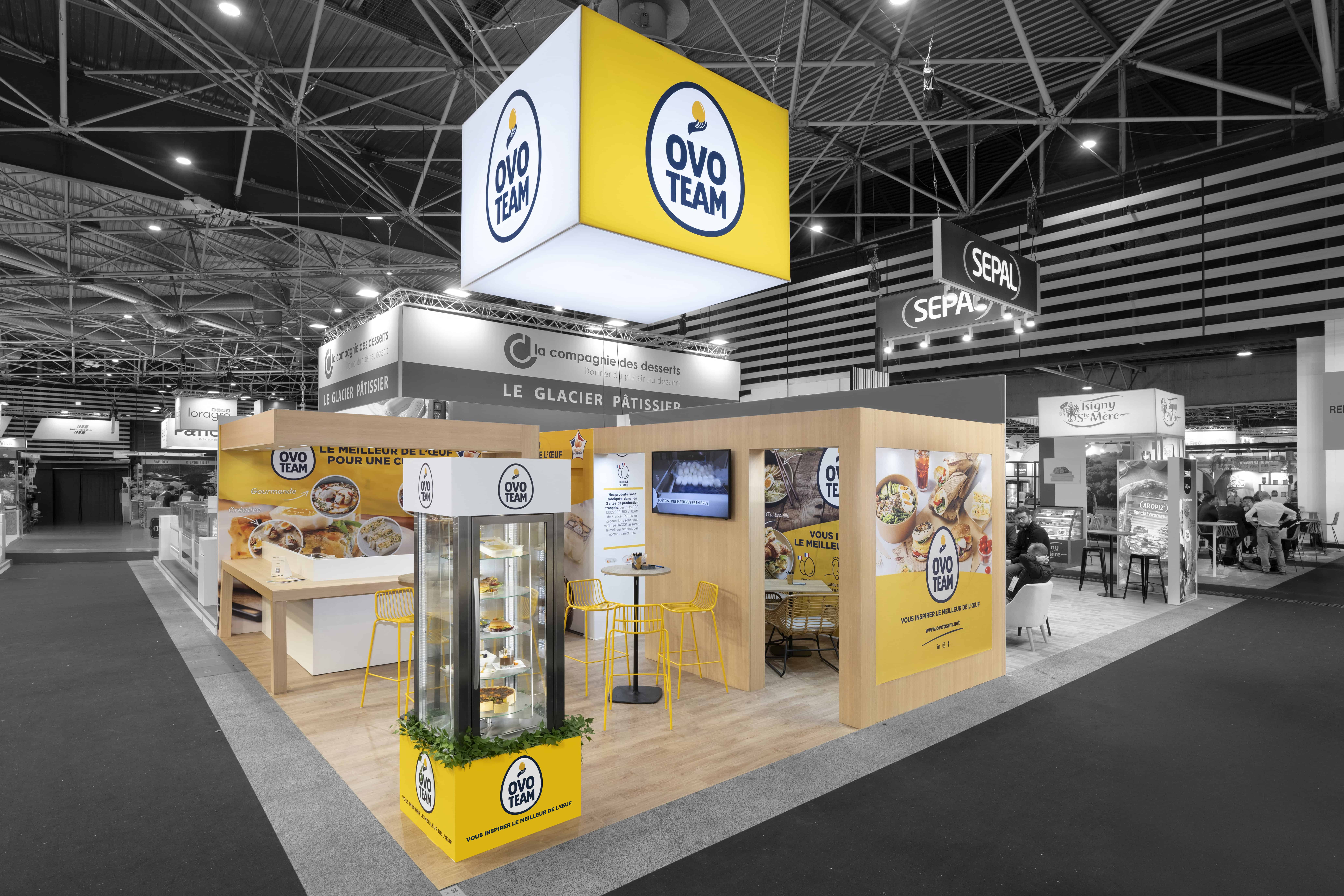 Co-Nect Ovoteam booth at trade show with branding and product display.