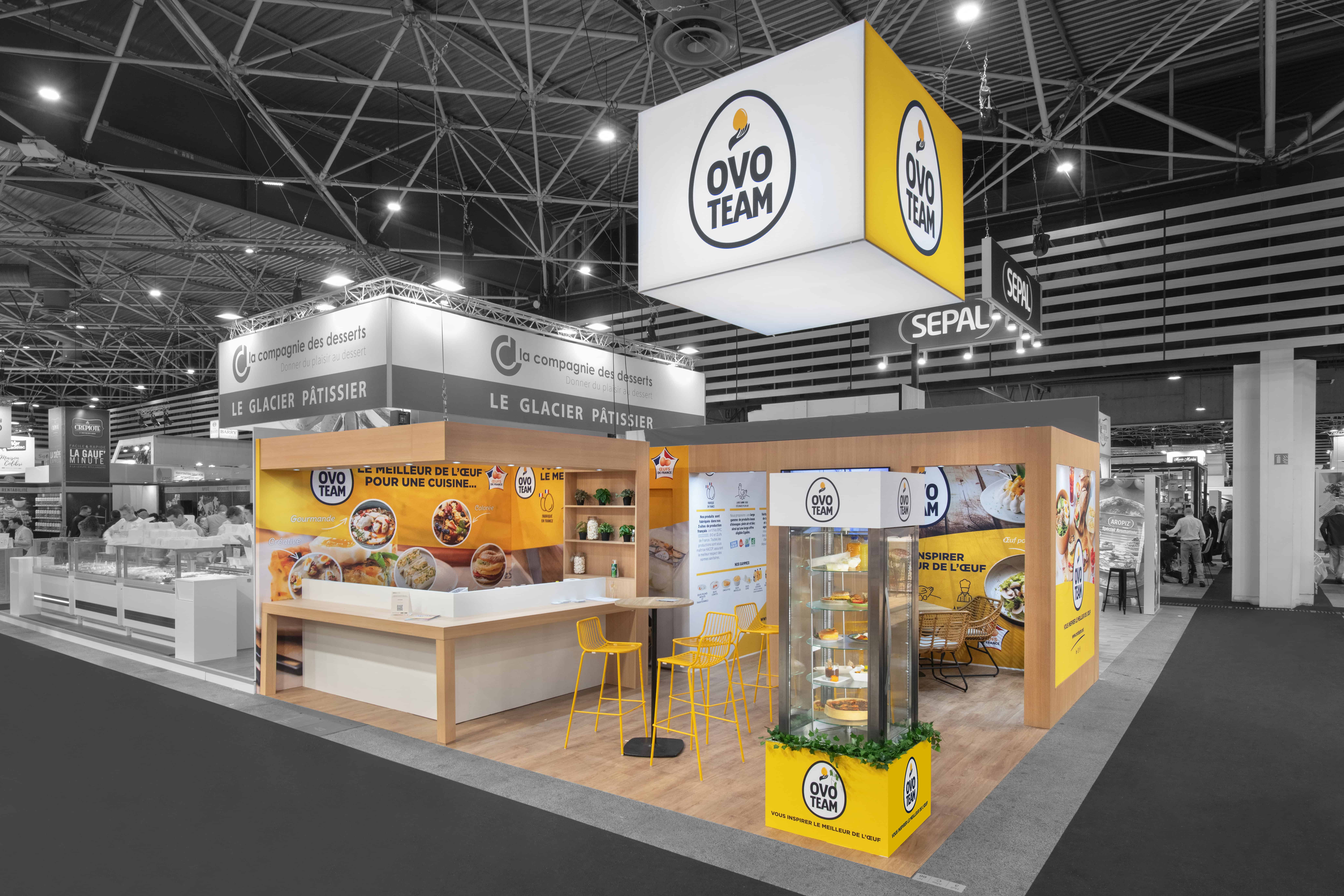 Co-Nect Ovoteam booth at trade show with branding and product display.