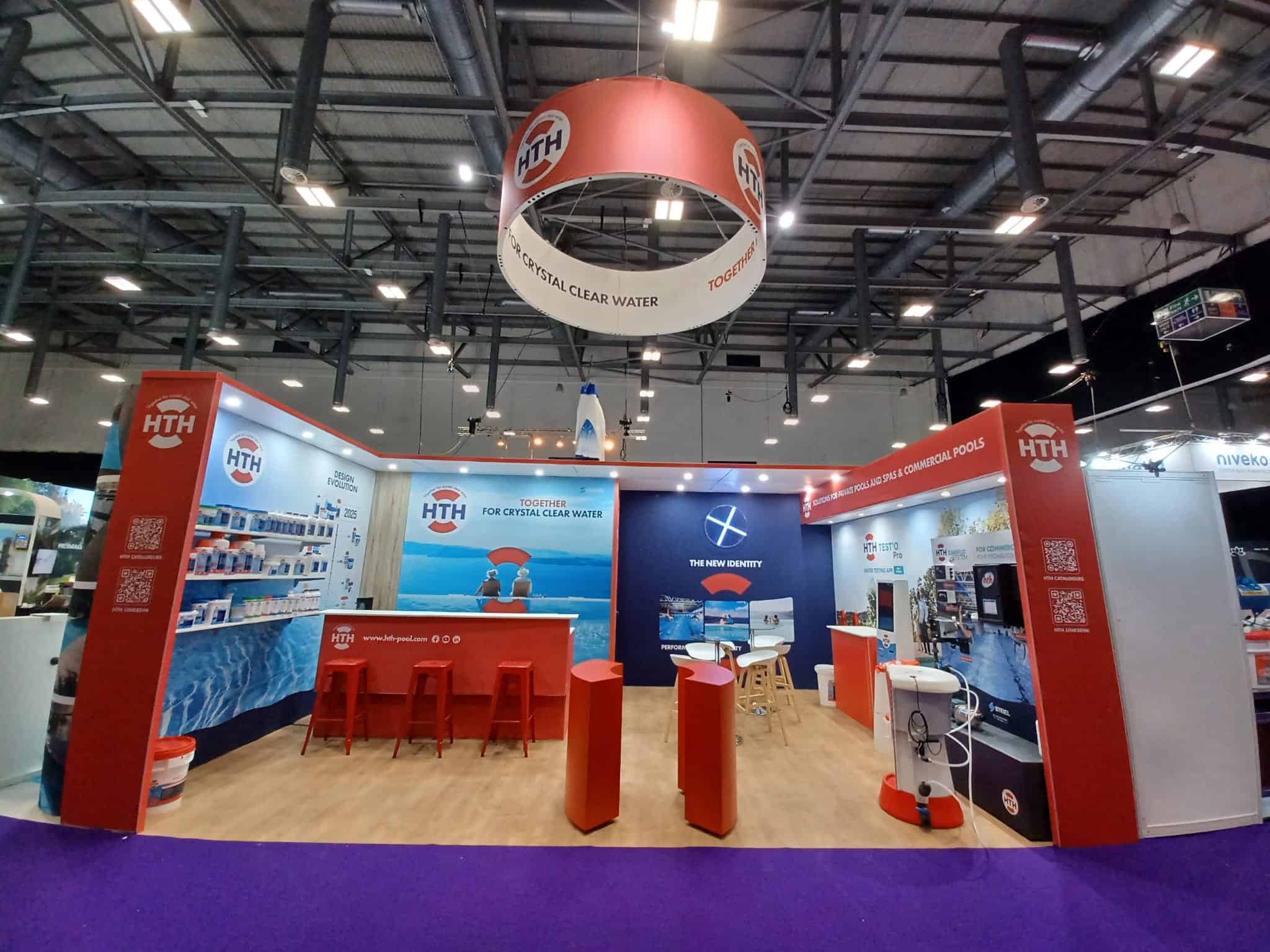Co-Nect booth showcasing water treatment solutions at industry event.