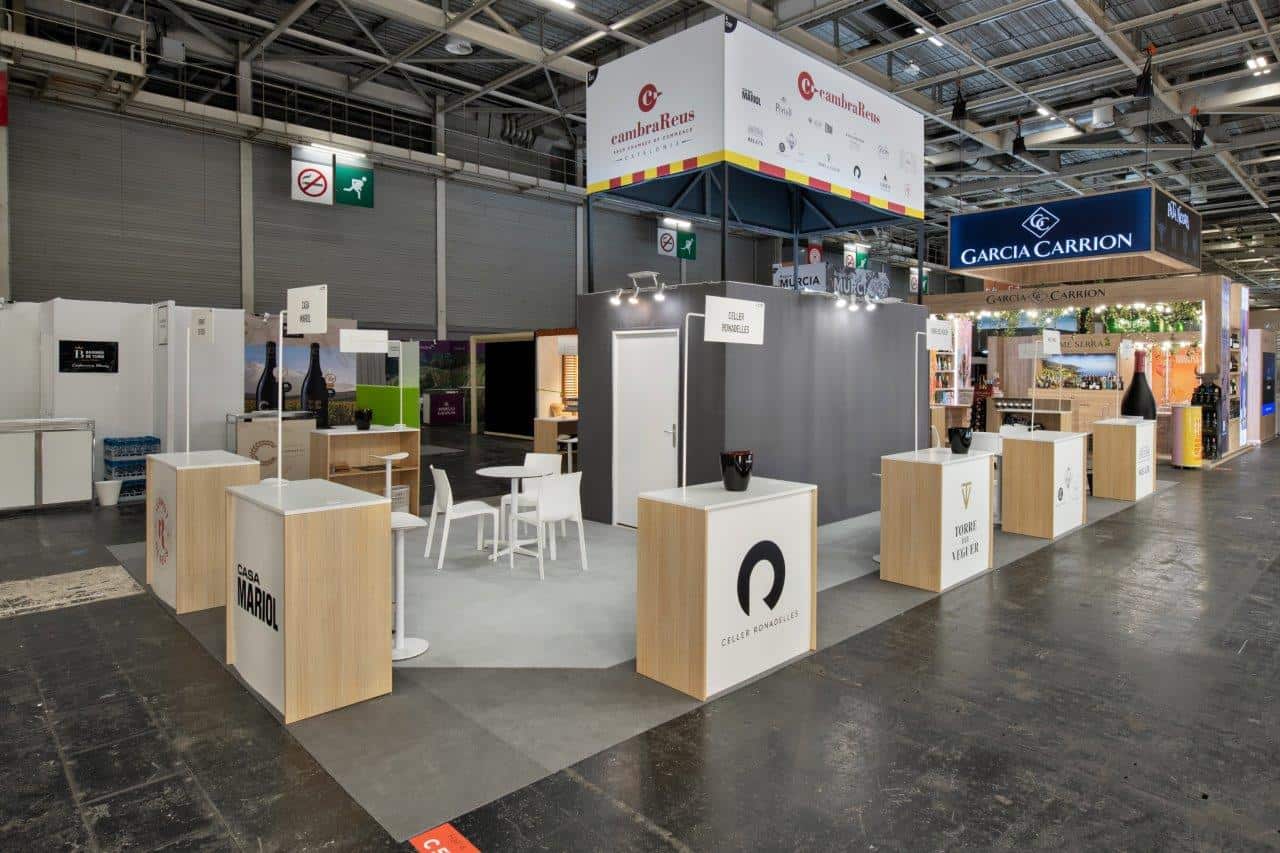 Exhibition booth at WINE PARIS showcasing wine-related brands and products.